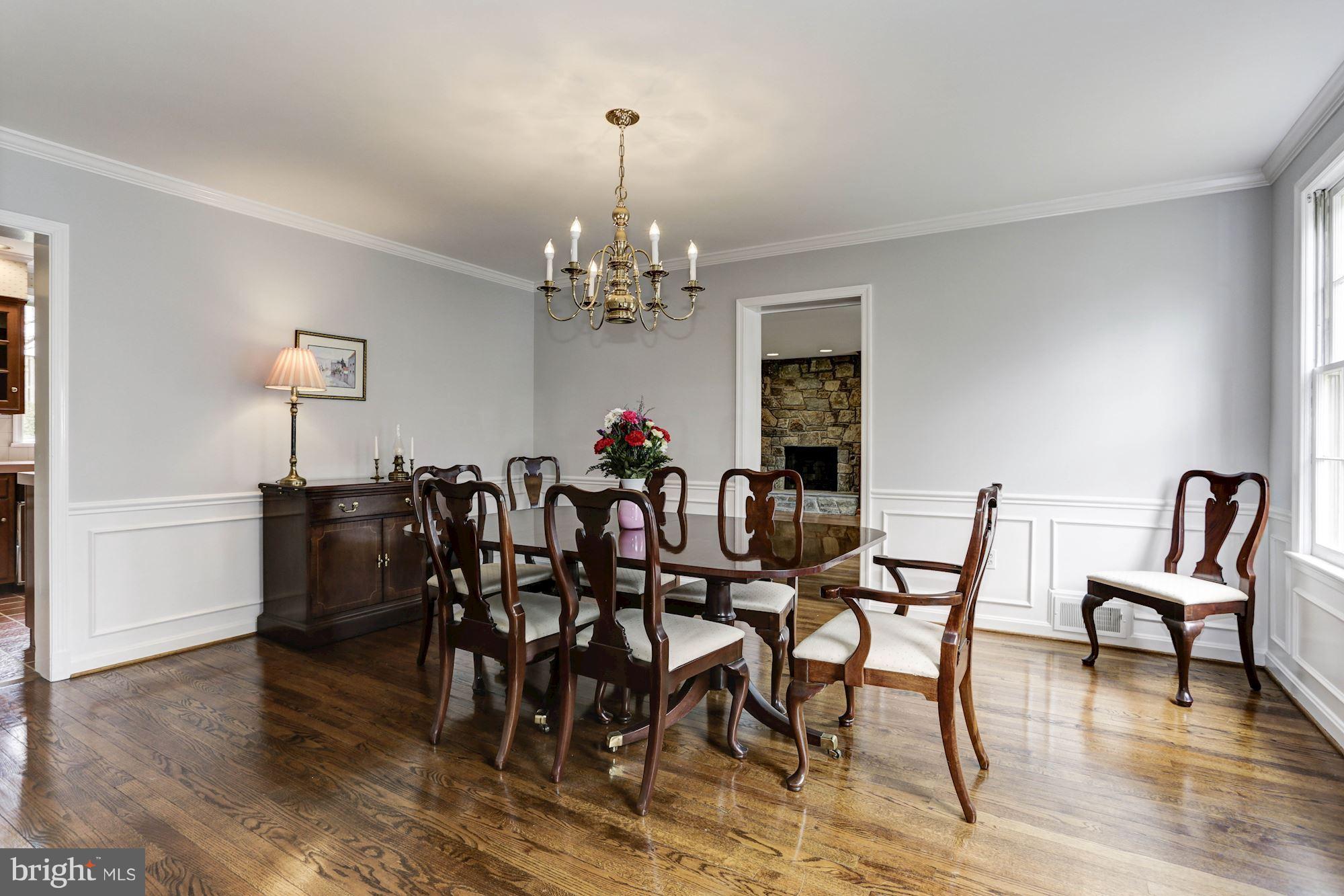6015 Overlea Road Bethesda, MD 20816 - Photo 13 of 30 a view of a dining room with furniture and wooden floor