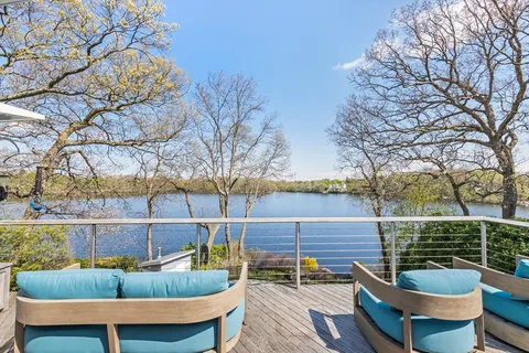 a view of a chair and table in the patio