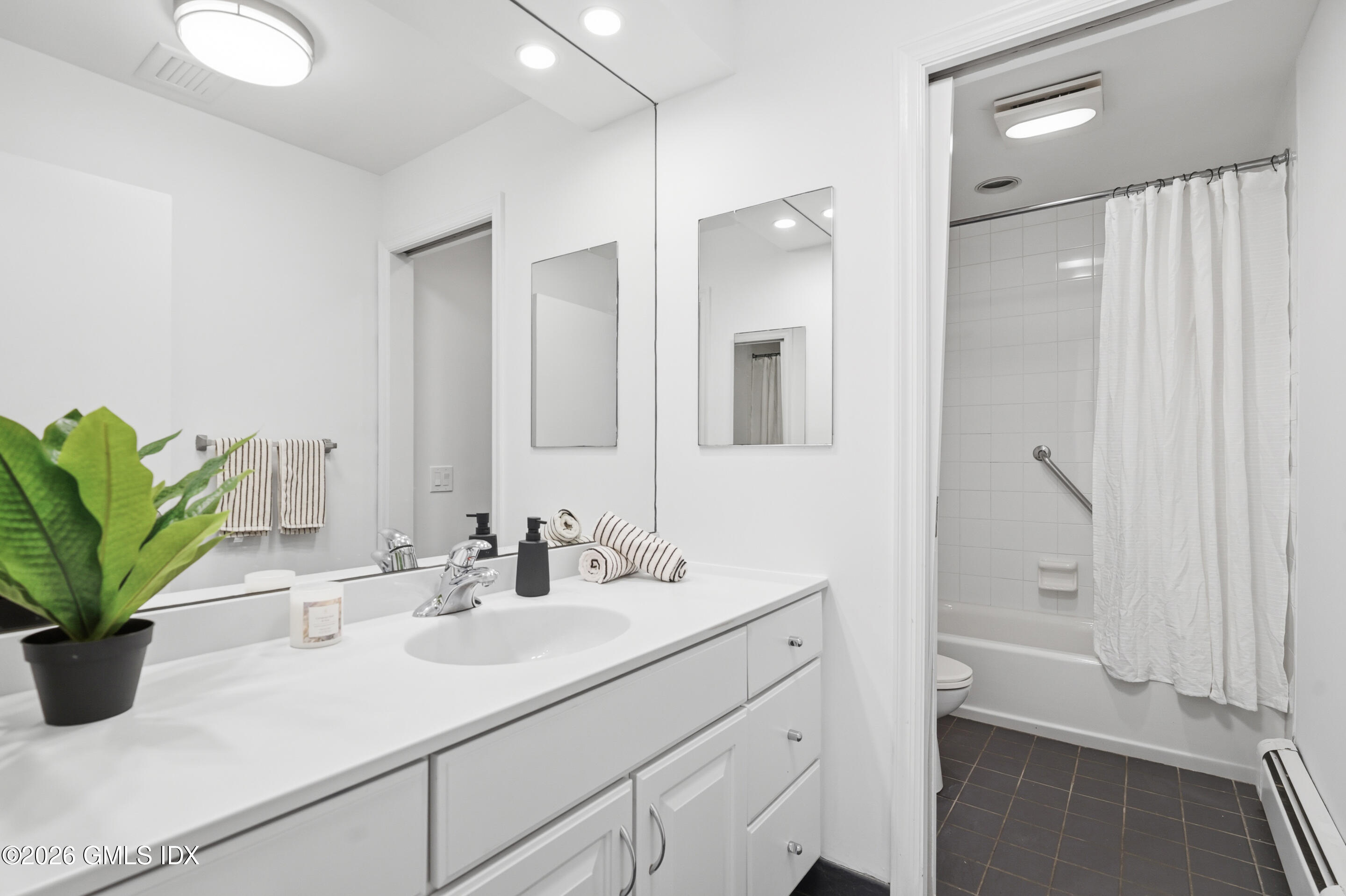 33 Sachem Road Greenwich, CT 06830 - Photo 16 of 35 a bathroom with a sink a vanity and a mirror