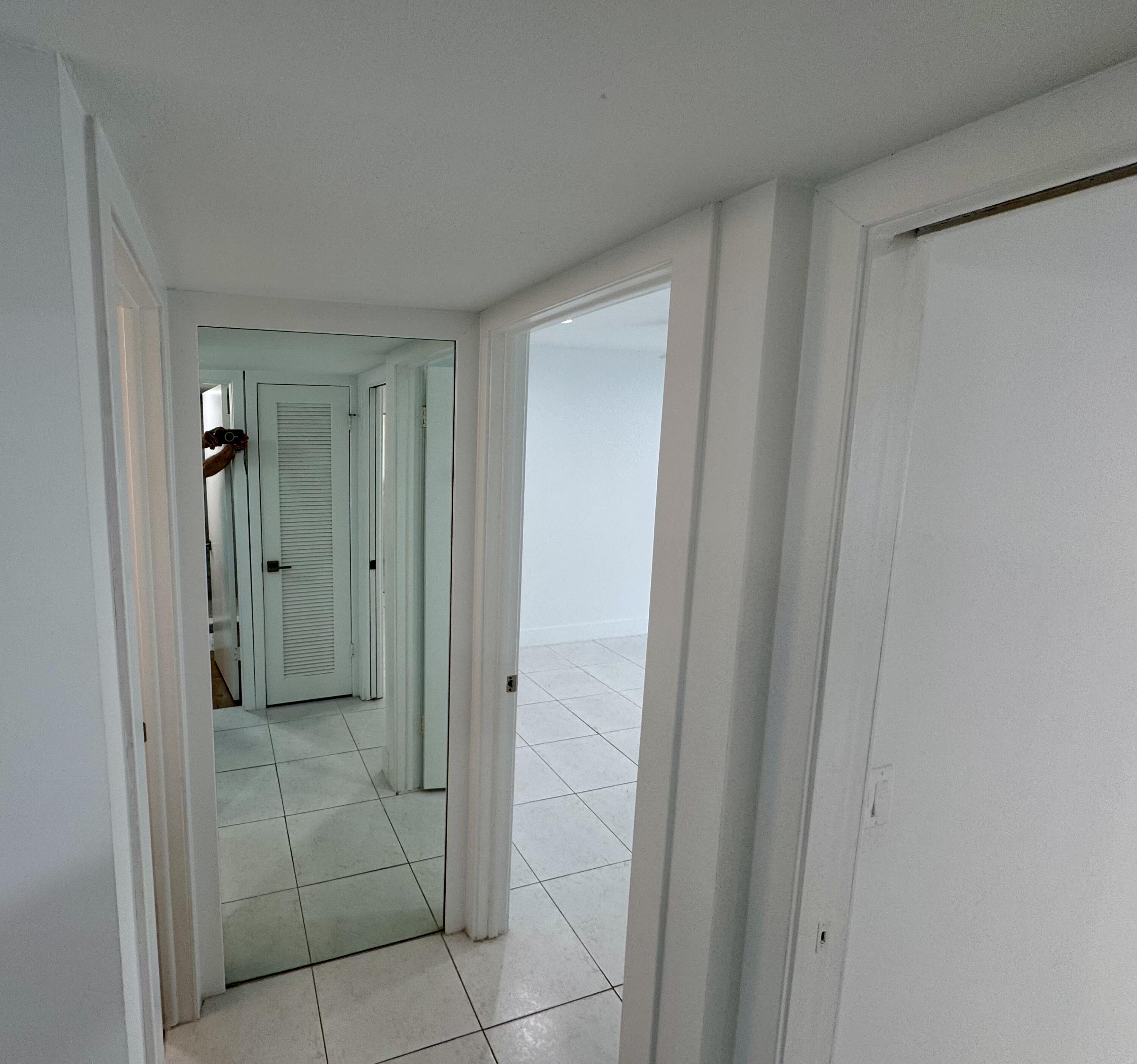 541 Normandy L Delray Beach, FL 33484 - Photo 12 of 55 a bathroom with a shower and a glass door