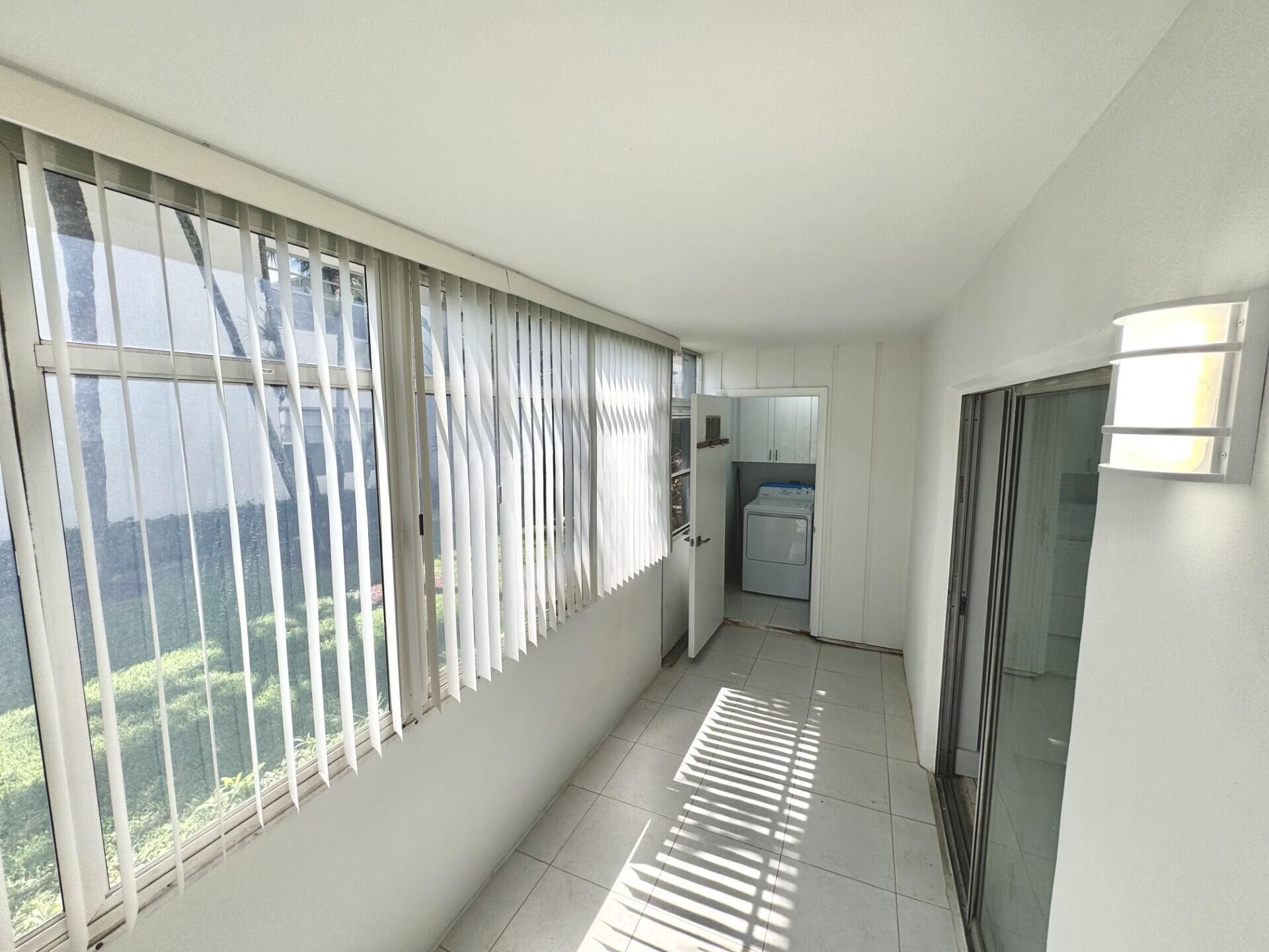 541 Normandy L Delray Beach, FL 33484 - Photo 20 of 55 a view of entryway with stairs
