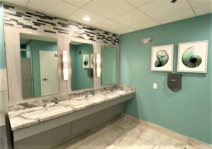 541 Normandy L Delray Beach, FL 33484 - Photo 35 of 55 a bathroom with a sink and a mirror