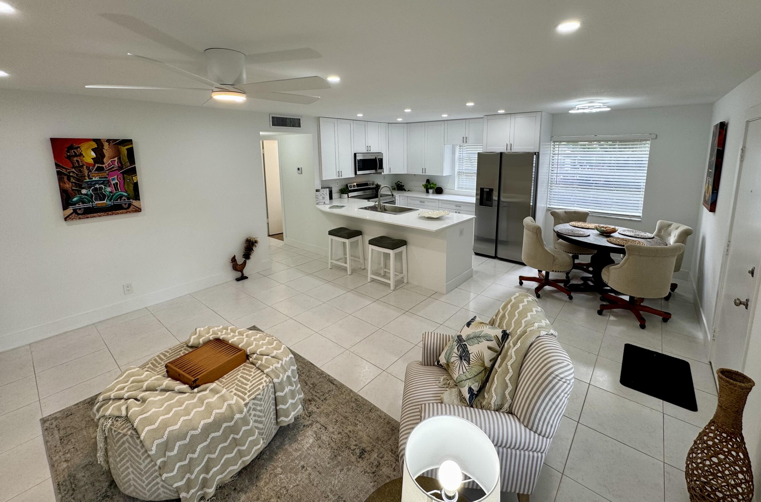 541 Normandy L Delray Beach, FL 33484 - Photo 7 of 55 a living room with furniture kitchen and a window