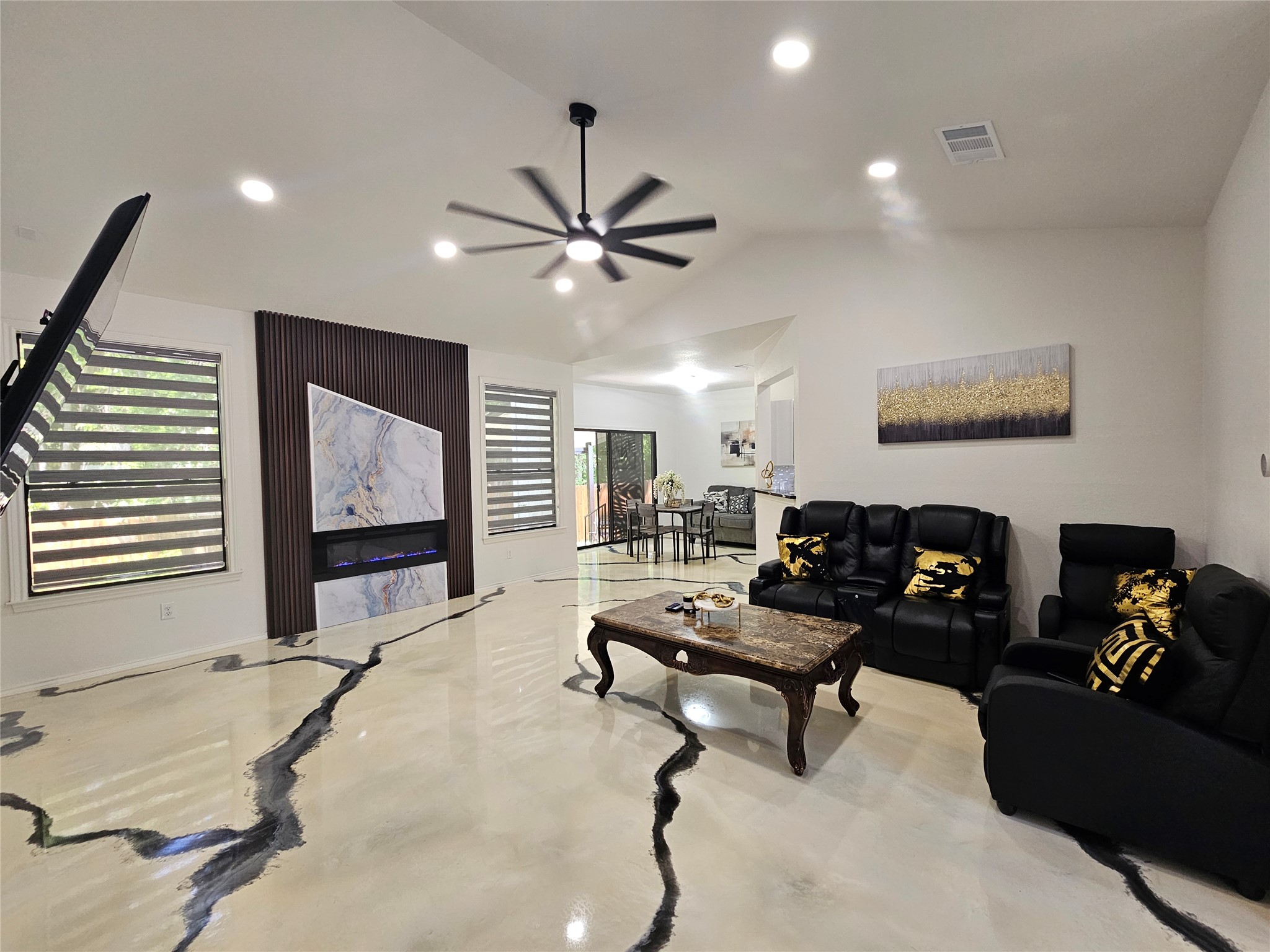 a living room with furniture and a flat screen tv