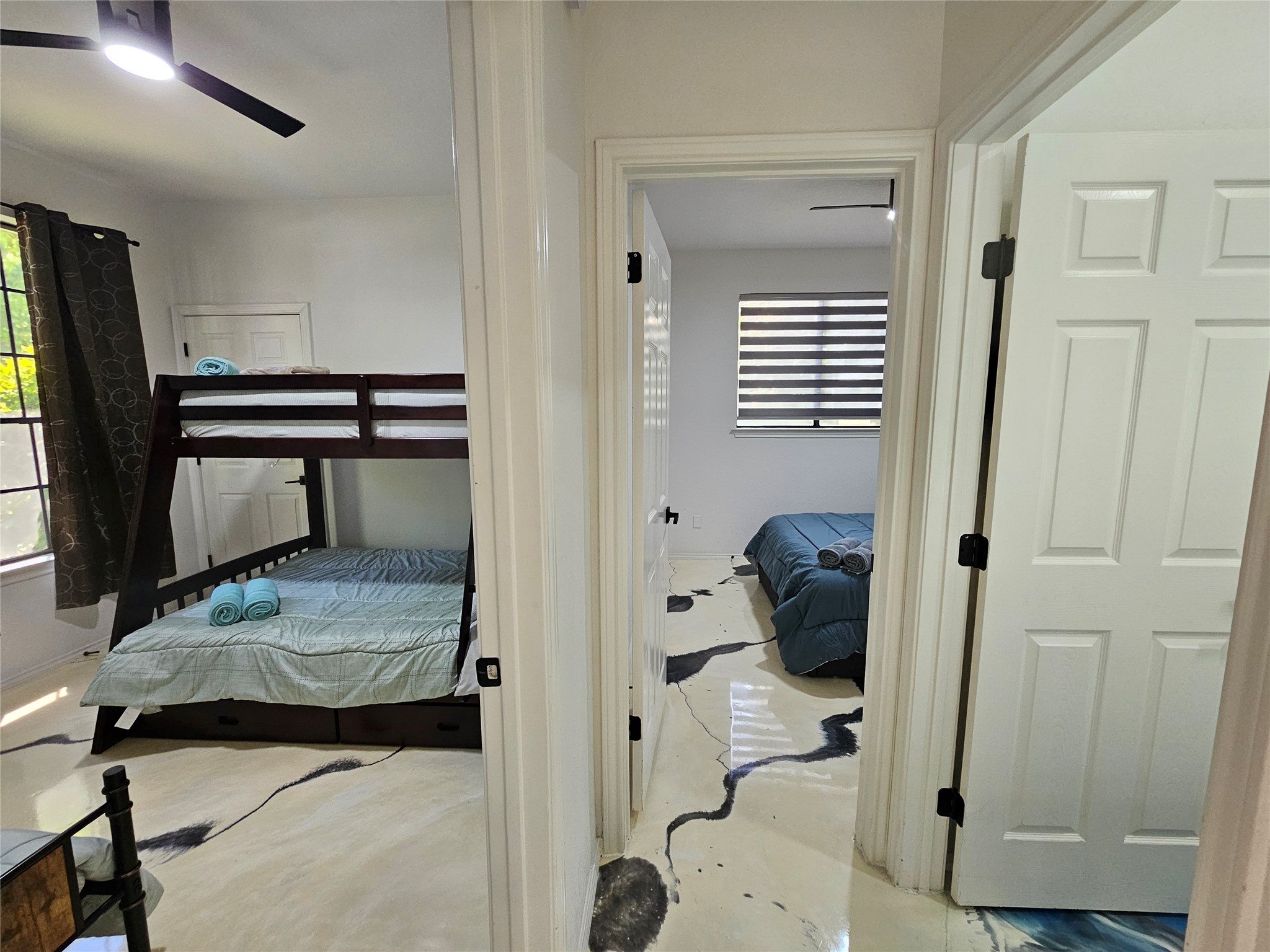 11806 Prairie Hen Lane Austin, TX 78758 - Photo 14 of 16 a bedroom with a bed and a window