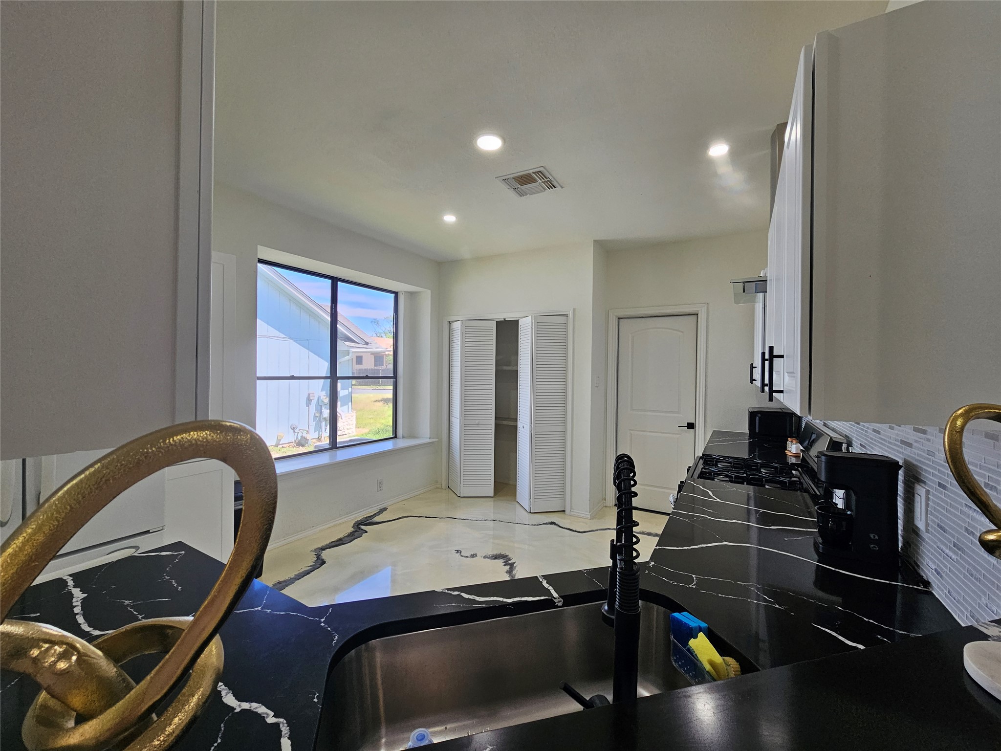 11806 Prairie Hen Lane Austin, TX 78758 - Photo 5 of 16 a room with a bed and a window