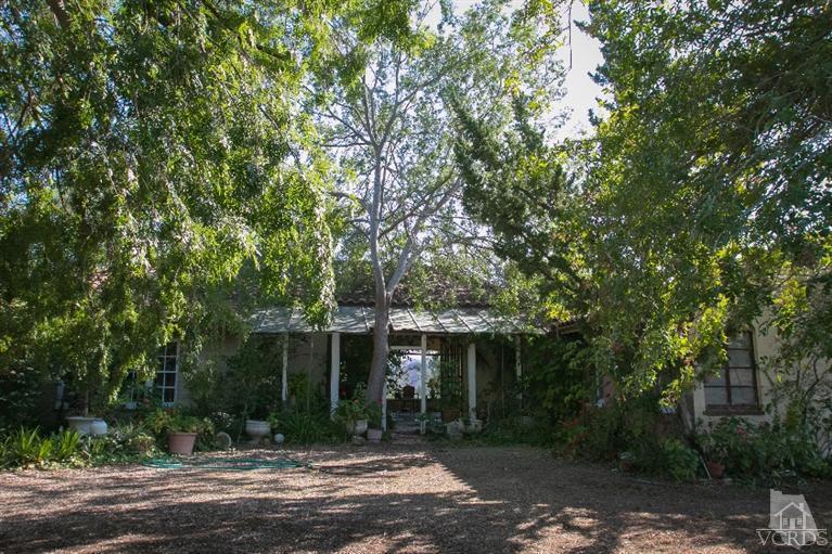 1815 La Granada Drive Thousand Oaks, CA 91362 - Photo 19 of 38 a front view of a house with a yard and trees