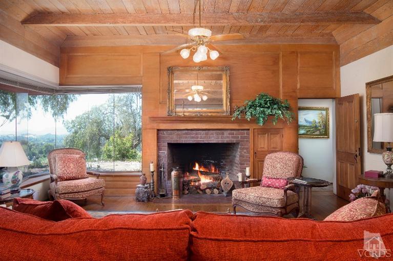 1815 La Granada Drive Thousand Oaks, CA 91362 - Photo 3 of 38 a living room with furniture a fireplace and a large window