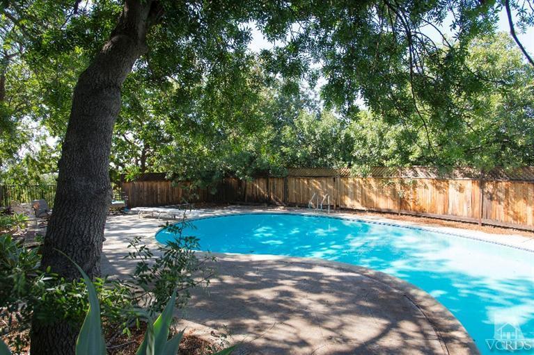1815 La Granada Drive Thousand Oaks, CA 91362 - Photo 29 of 38 a view of a backyard with large trees and wooden fence