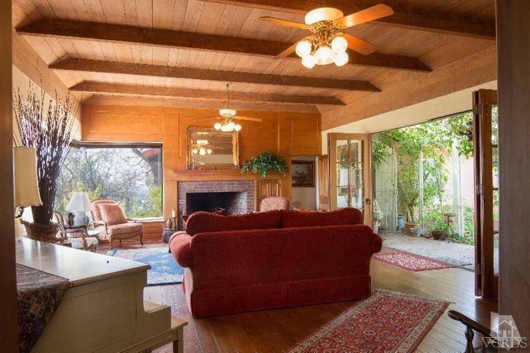 1815 La Granada Drive Thousand Oaks, CA 91362 - Photo 5 of 38 a living room with furniture a fireplace and a chandelier