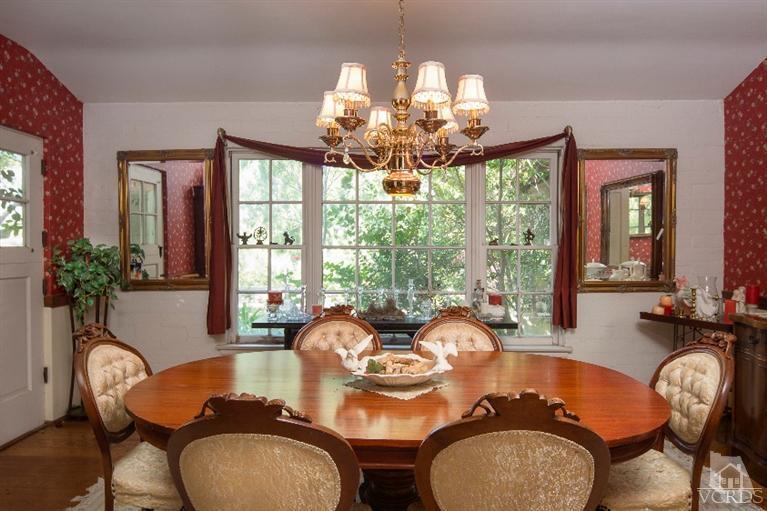 1815 La Granada Drive Thousand Oaks, CA 91362 - Photo 8 of 38 a dining room with furniture a large window and wooden floor