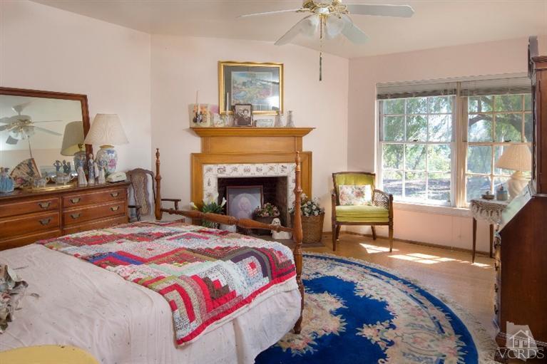1815 La Granada Drive Thousand Oaks, CA 91362 - Photo 9 of 38 a bedroom with a bed and a fireplace