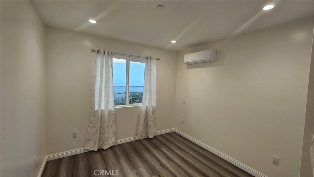 1203 Shorb Alhambra, CA 91803 - Photo 11 of 22 a view of an empty room with wooden floor and a window