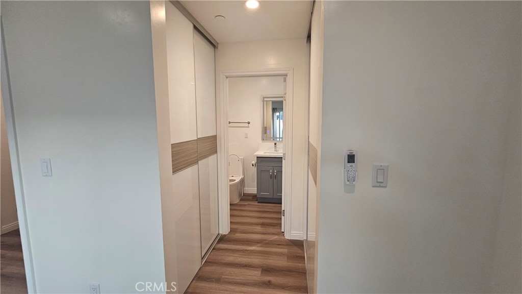 1203 Shorb Alhambra, CA 91803 - Photo 14 of 22 a view of a hallway with wooden floor and staircase