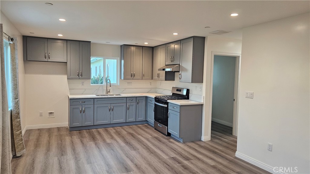 1203 Shorb Alhambra, CA 91803 - Photo 6 of 22 a large kitchen with a lot of counter space and stainless steel appliances