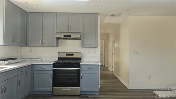 a kitchen with a stove and a cabinet