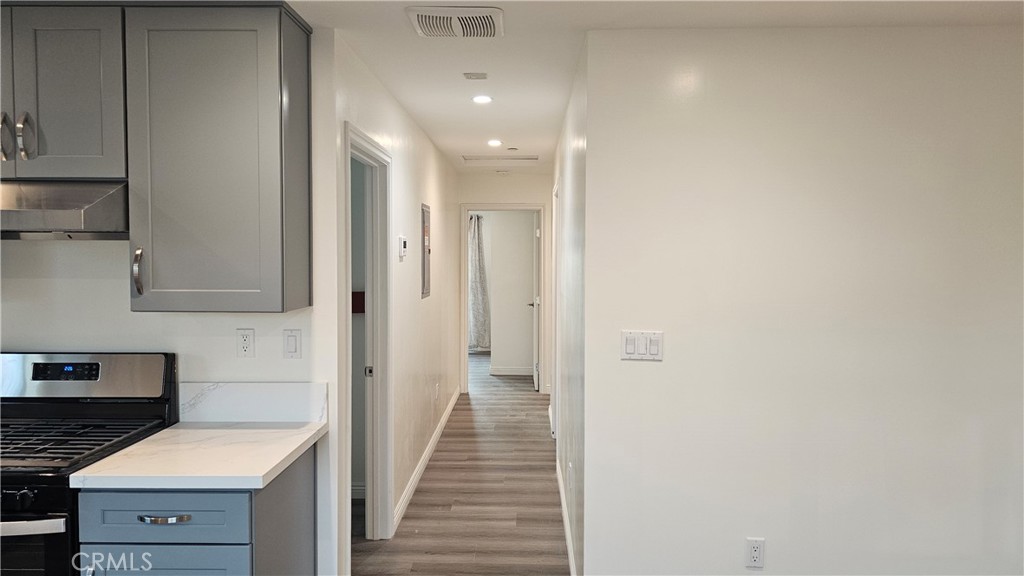 1203 Shorb Alhambra, CA 91803 - Photo 9 of 22 a view of a hallway with wooden floor and cabinets