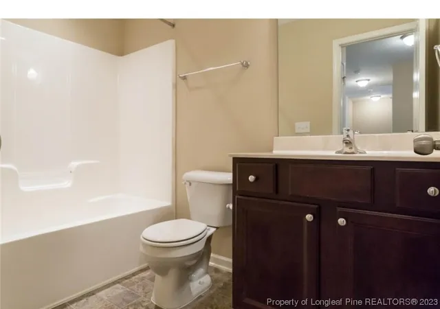 a bathroom with a toilet a sink and a bathtub