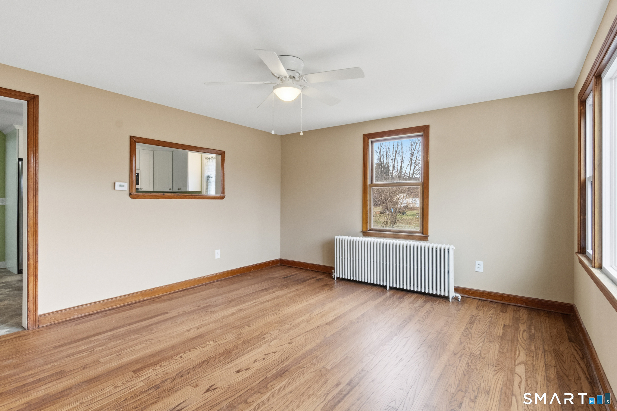 217 East Waterbury Road Naugatuck, CT 06770 - Photo 14 of 38 a view of an empty room with wooden floor and a window