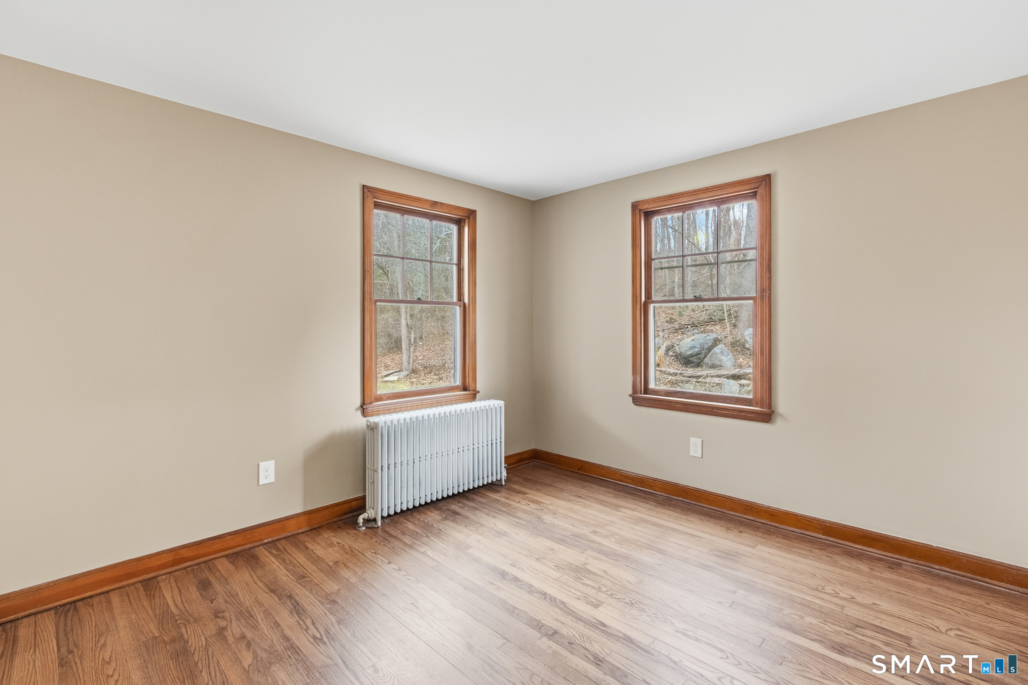 217 East Waterbury Road Naugatuck, CT 06770 - Photo 19 of 38 an empty room with wooden floor and windows