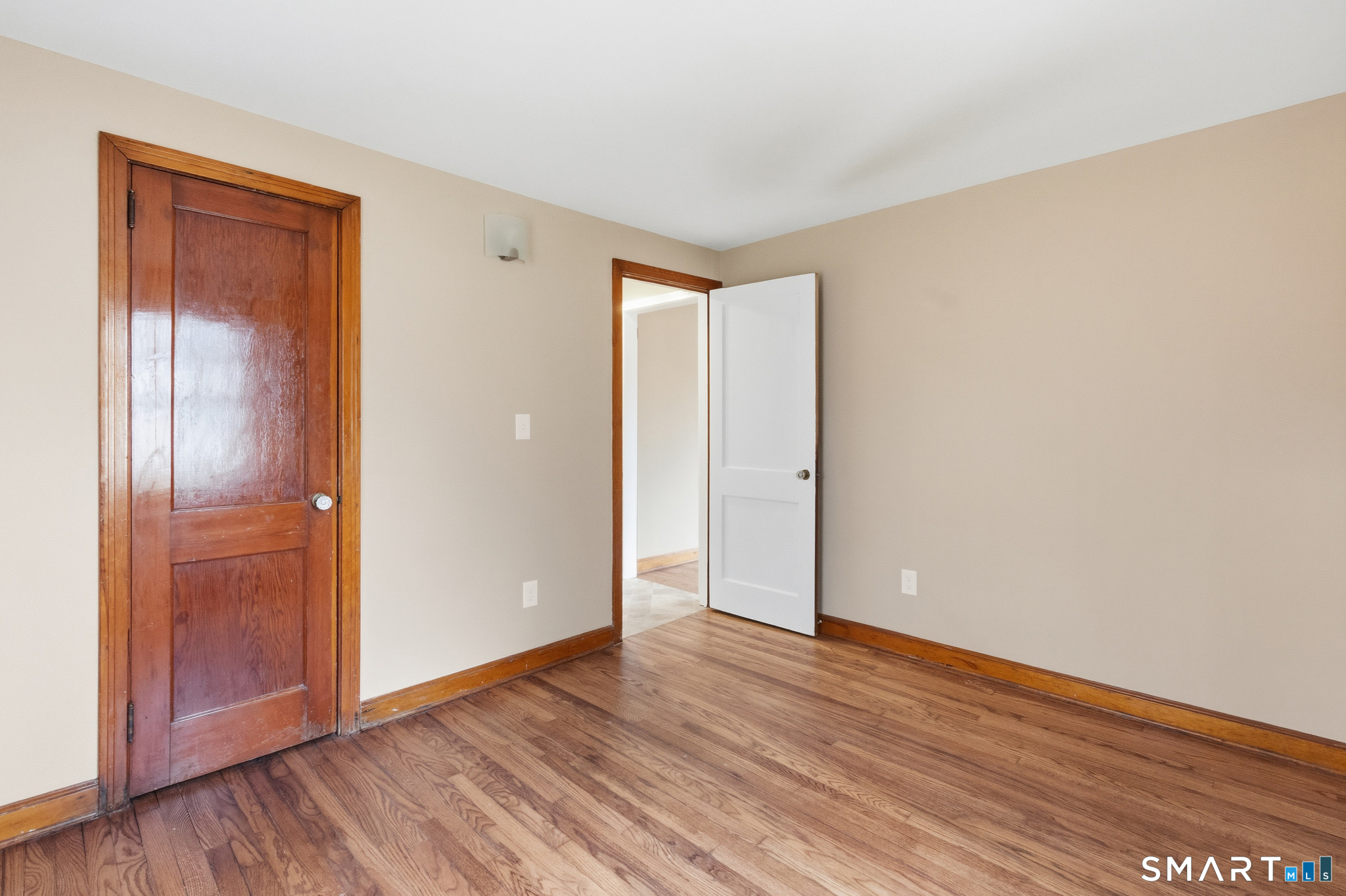 217 East Waterbury Road Naugatuck, CT 06770 - Photo 20 of 38 a view of an empty room with wooden floor and closet
