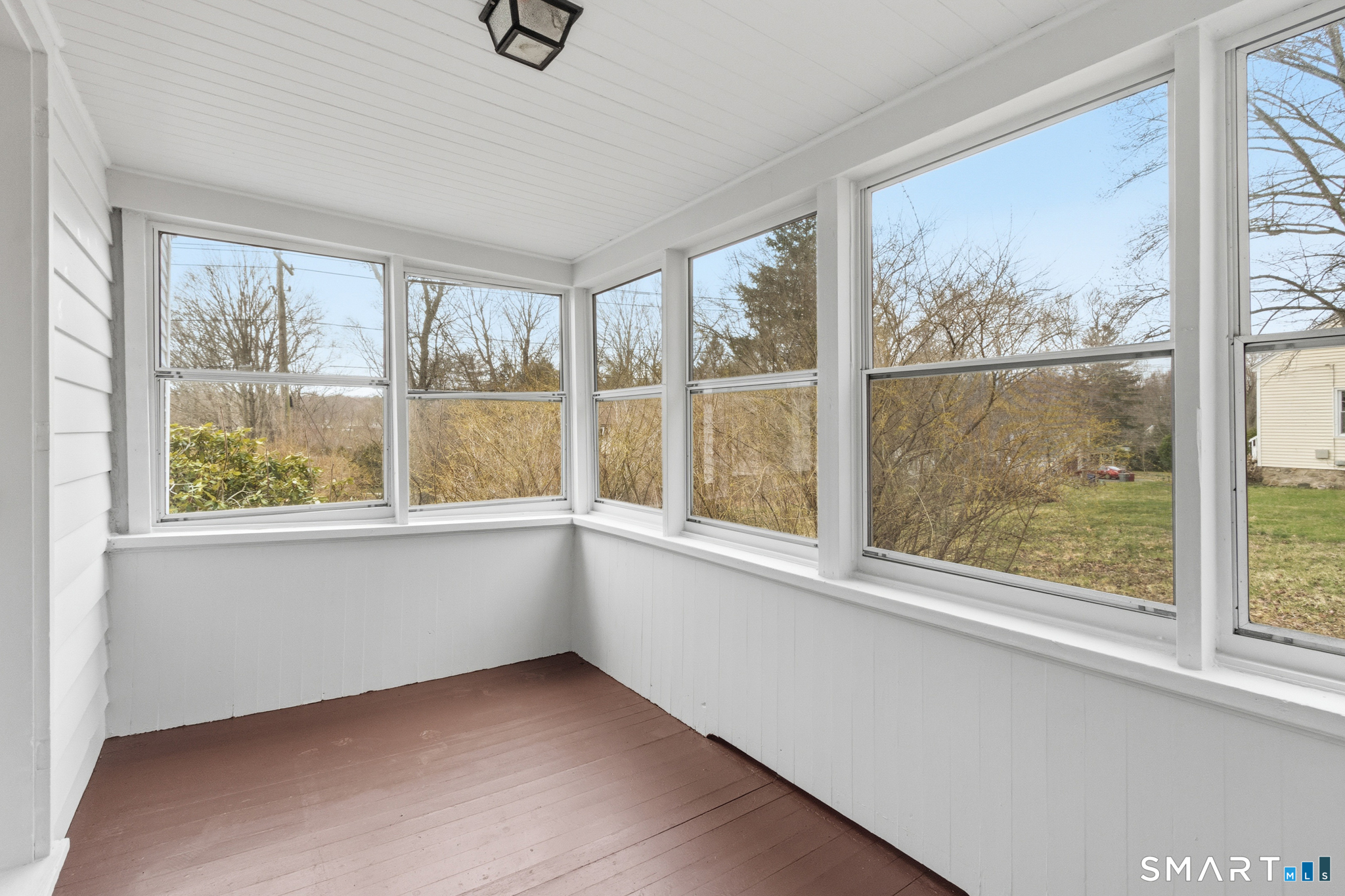 217 East Waterbury Road Naugatuck, CT 06770 - Photo 21 of 38 an empty room with wooden floor and windows
