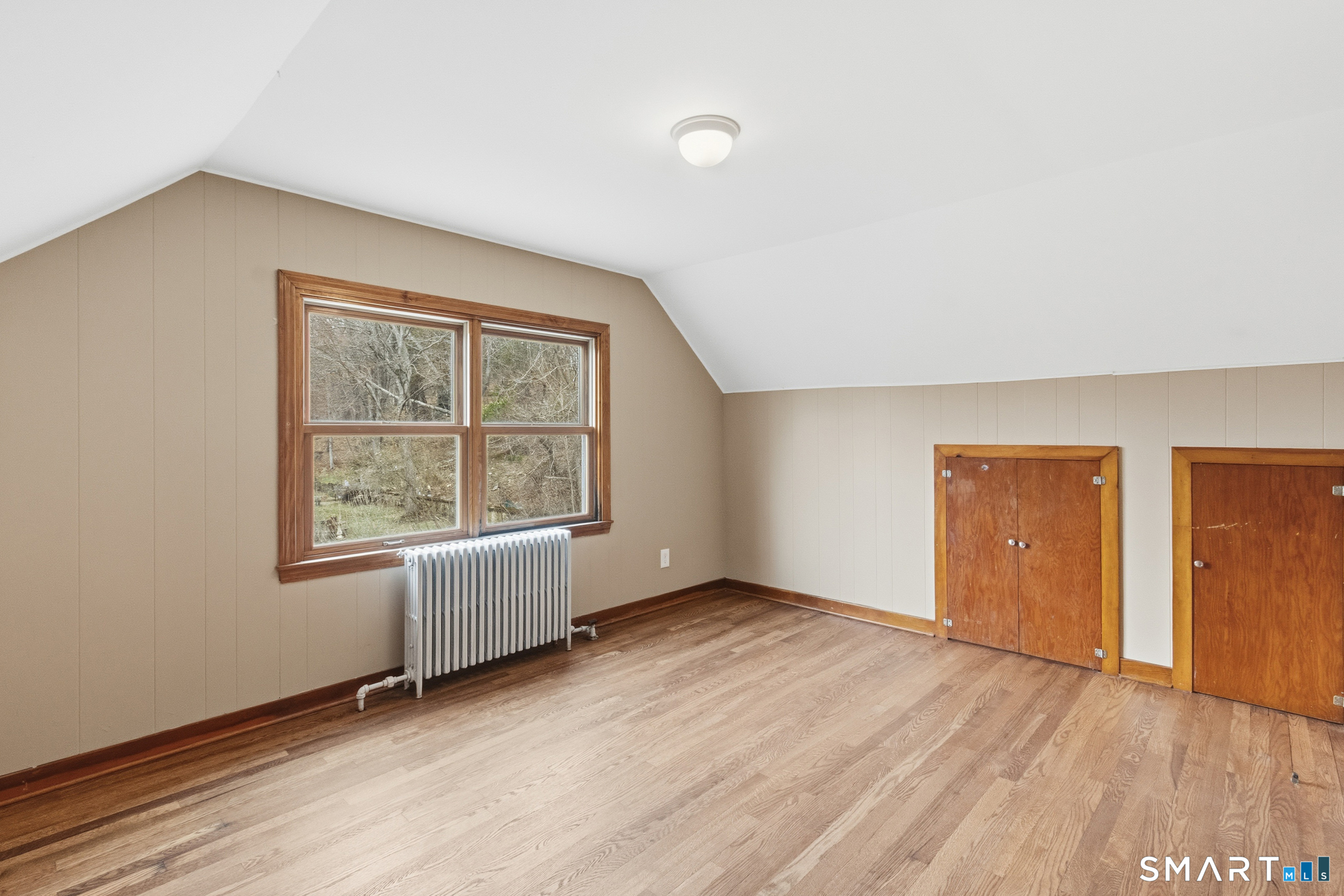 217 East Waterbury Road Naugatuck, CT 06770 - Photo 25 of 38 an empty room with wooden floor and windows