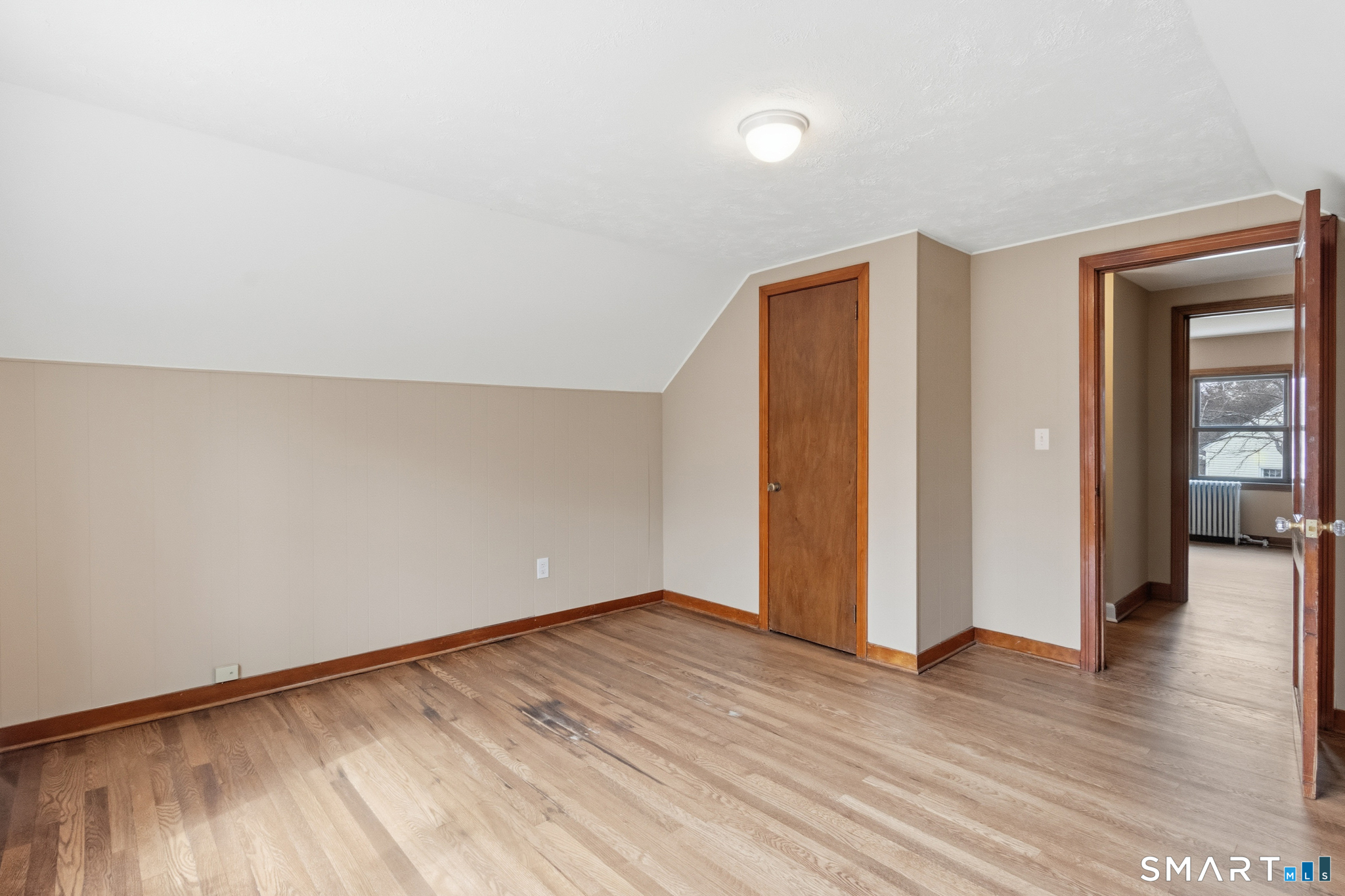 217 East Waterbury Road Naugatuck, CT 06770 - Photo 27 of 38 an empty room with wooden floor and windows