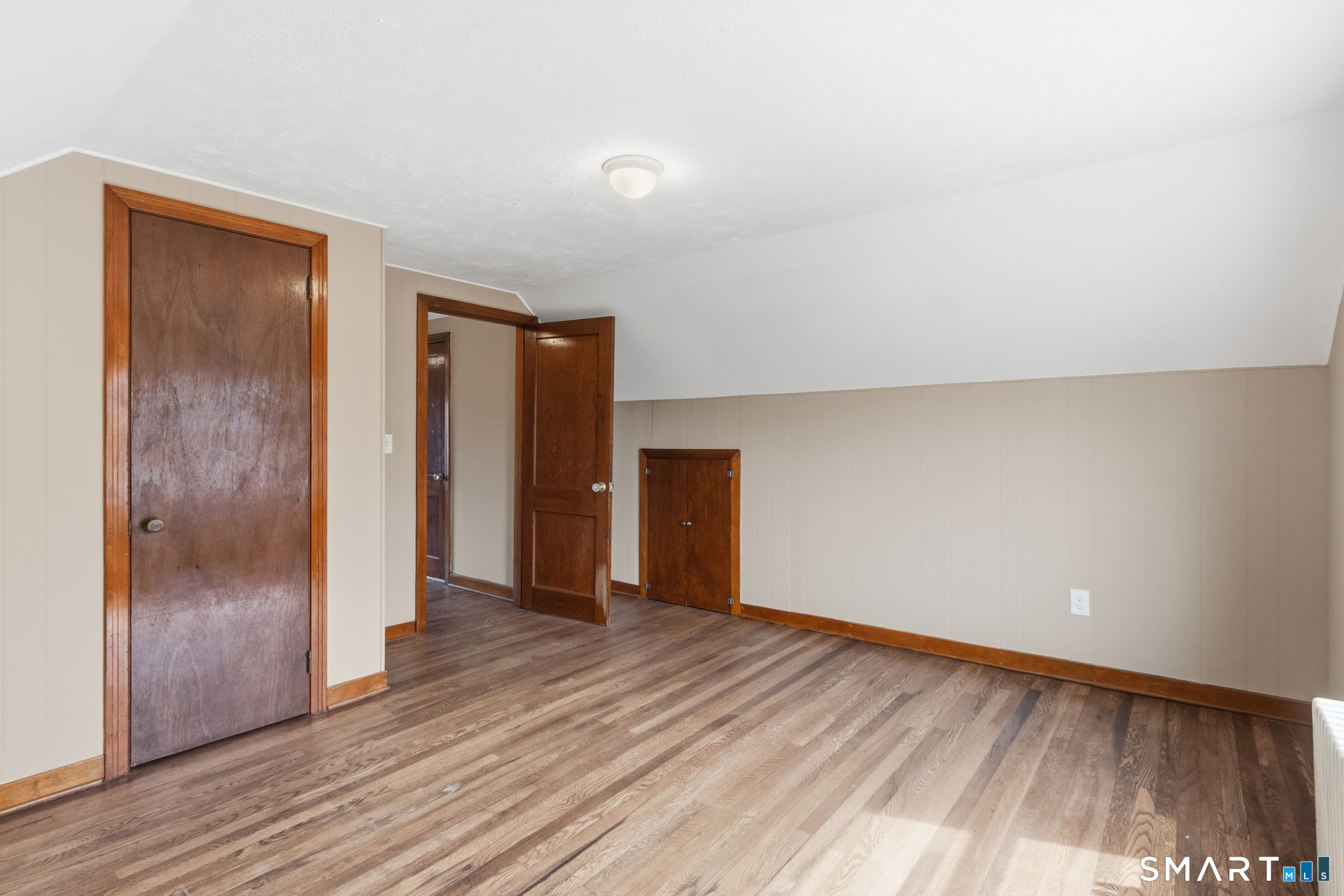 217 East Waterbury Road Naugatuck, CT 06770 - Photo 29 of 38 a view of an empty room with wooden floor and a window