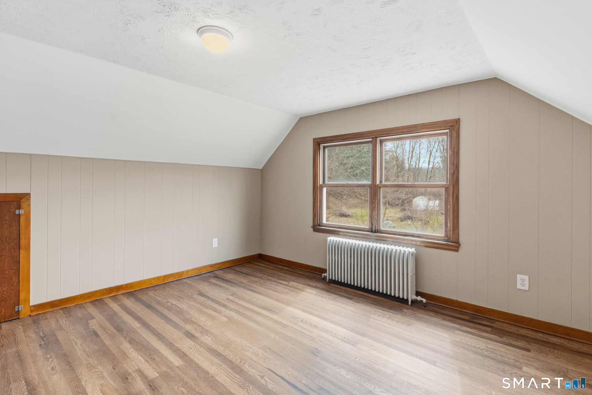 217 East Waterbury Road Naugatuck, CT 06770 - Photo 30 of 38 an empty room with wooden floor and windows