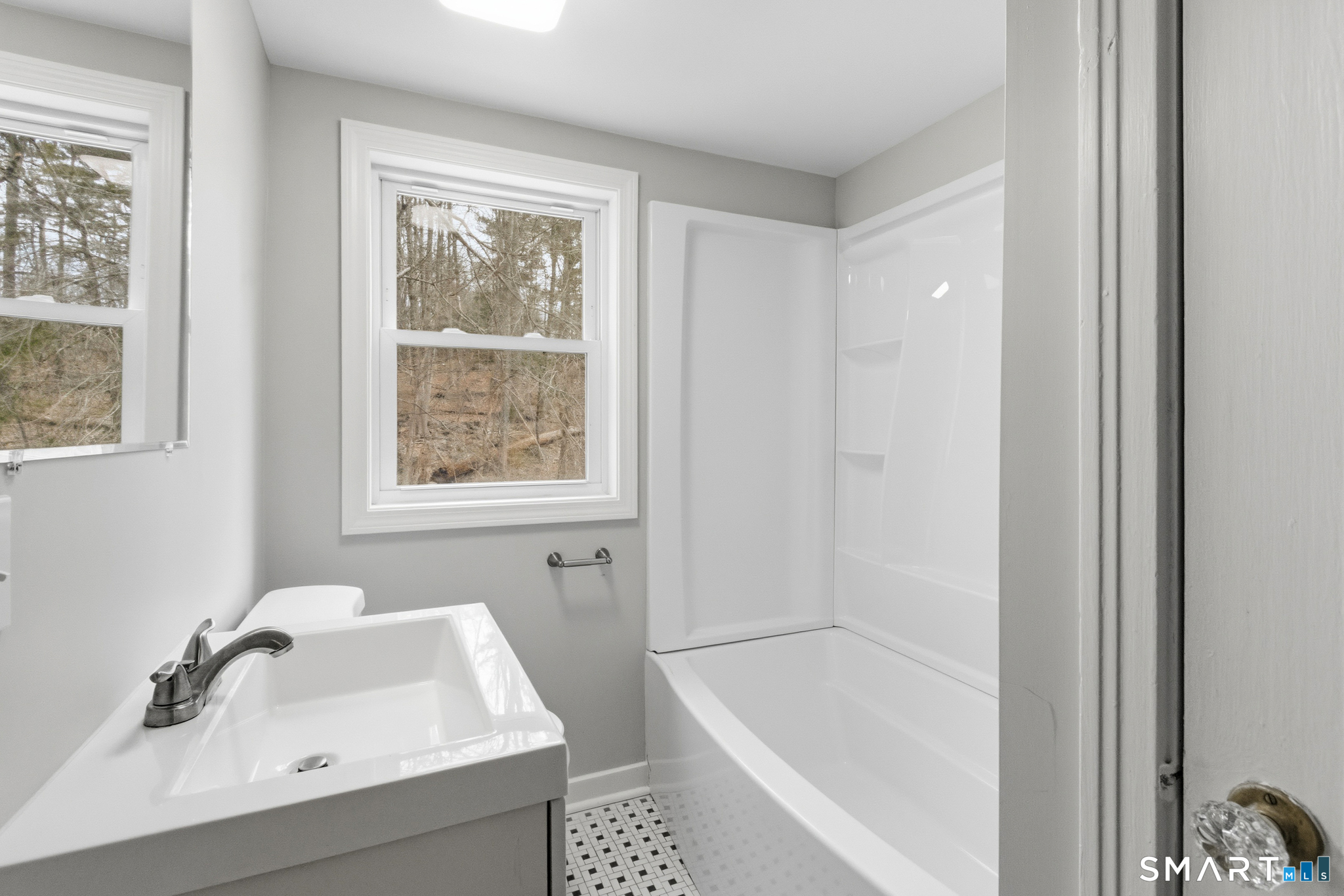 217 East Waterbury Road Naugatuck, CT 06770 - Photo 31 of 38 a bathroom with a tub sink and window