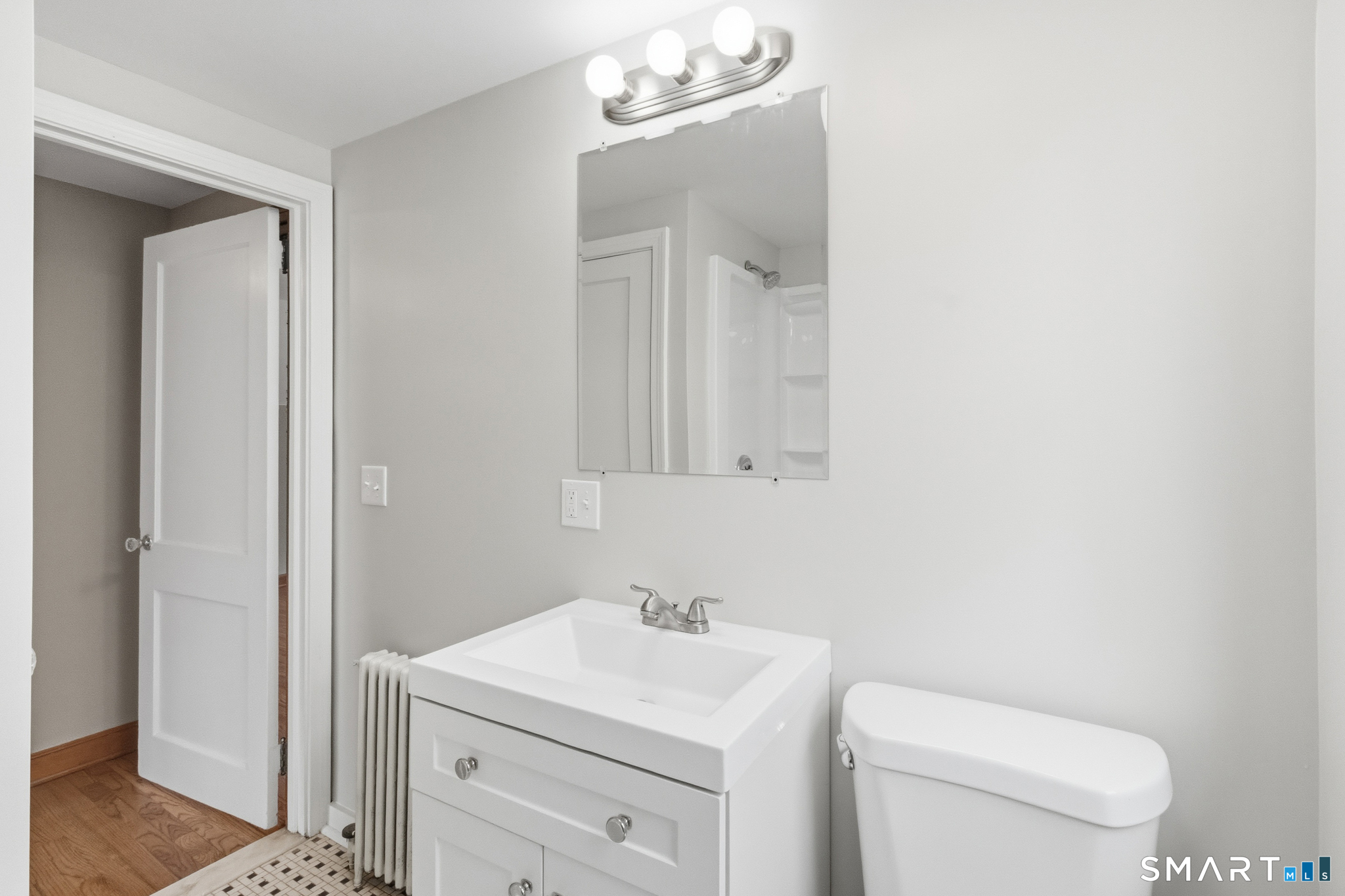 217 East Waterbury Road Naugatuck, CT 06770 - Photo 32 of 38 a bathroom with a toilet a sink and a mirror