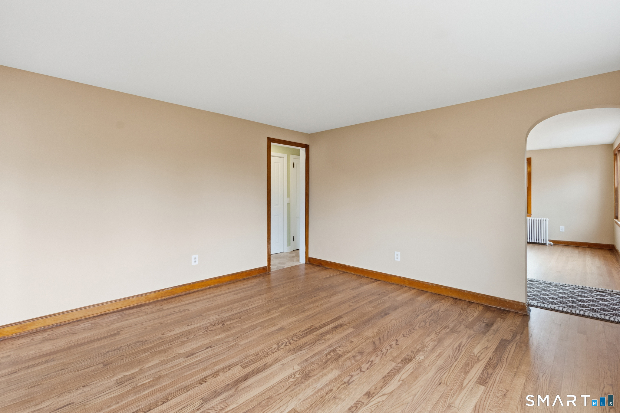 217 East Waterbury Road Naugatuck, CT 06770 - Photo 8 of 38 a view of an empty room with wooden floor and a window