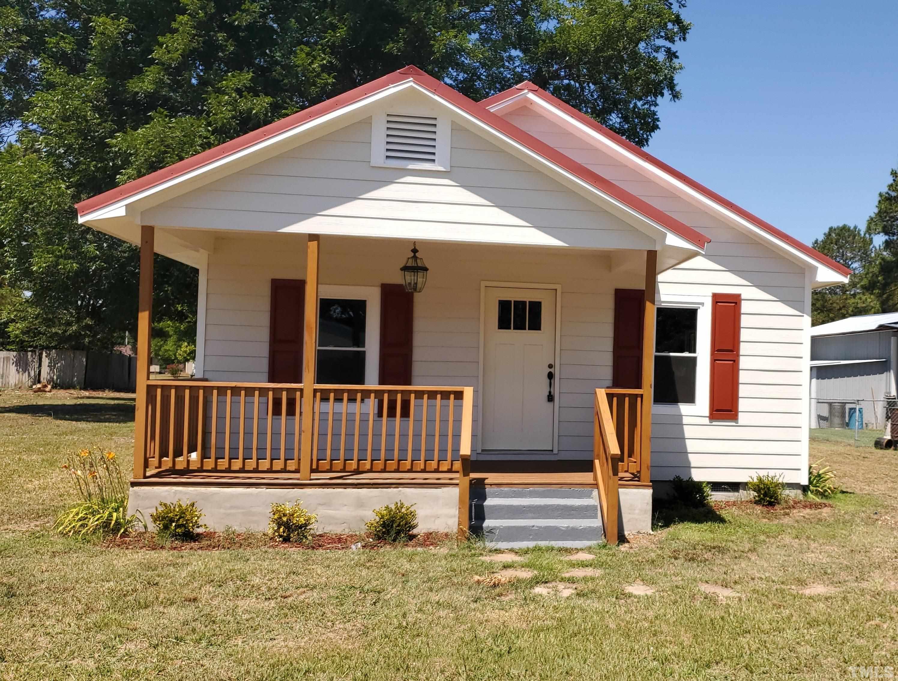 810 Raiford Road Erwin, NC 28339 - Photo 1 of 19 Cute ranch with new metal roof on the main house, new front porch railings and new exterior siding
