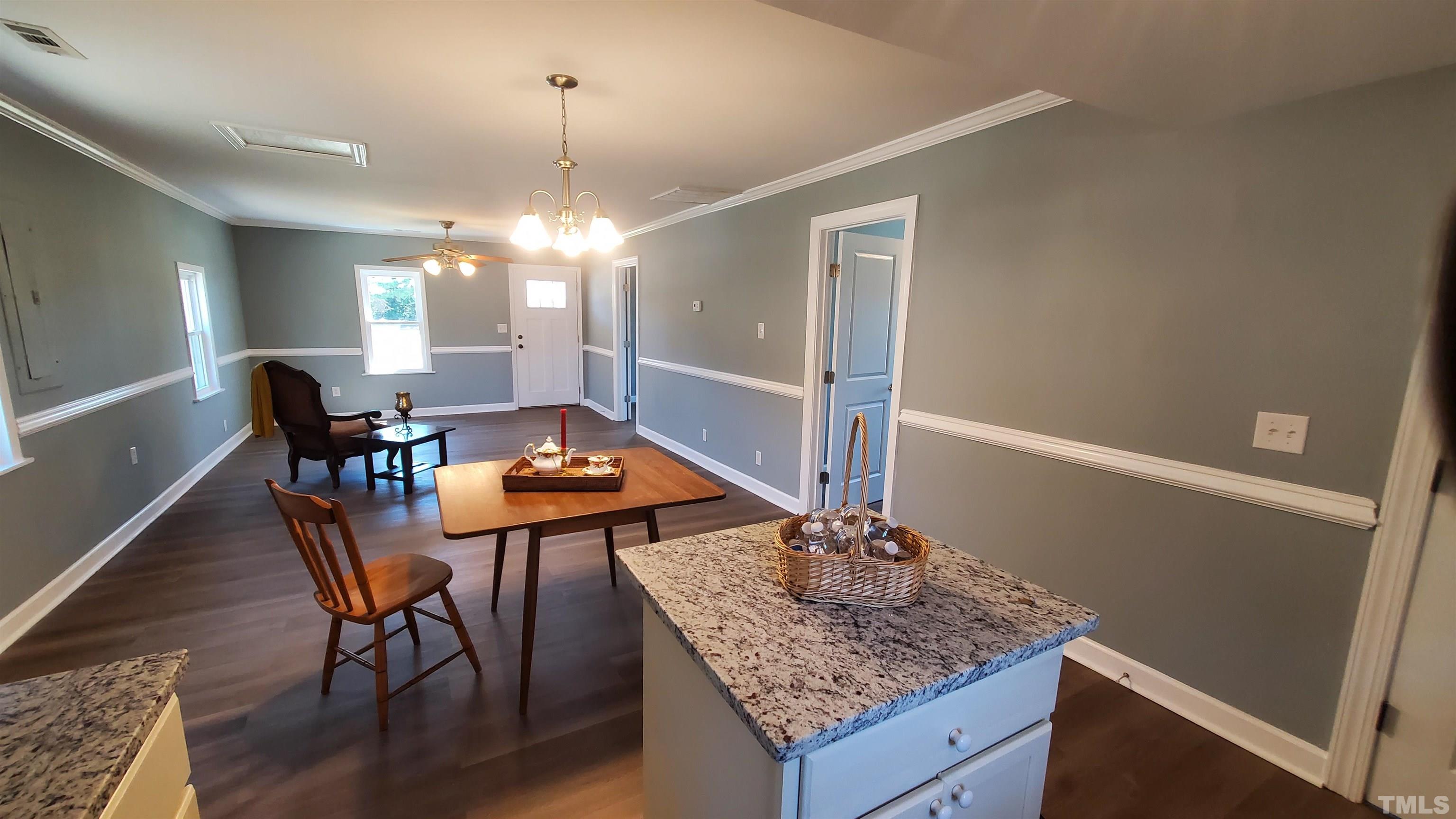 810 Raiford Road Erwin, NC 28339 - Photo 19 of 19 With this open floor plan, you can be in the kitchen and not miss any of the action with your guests.