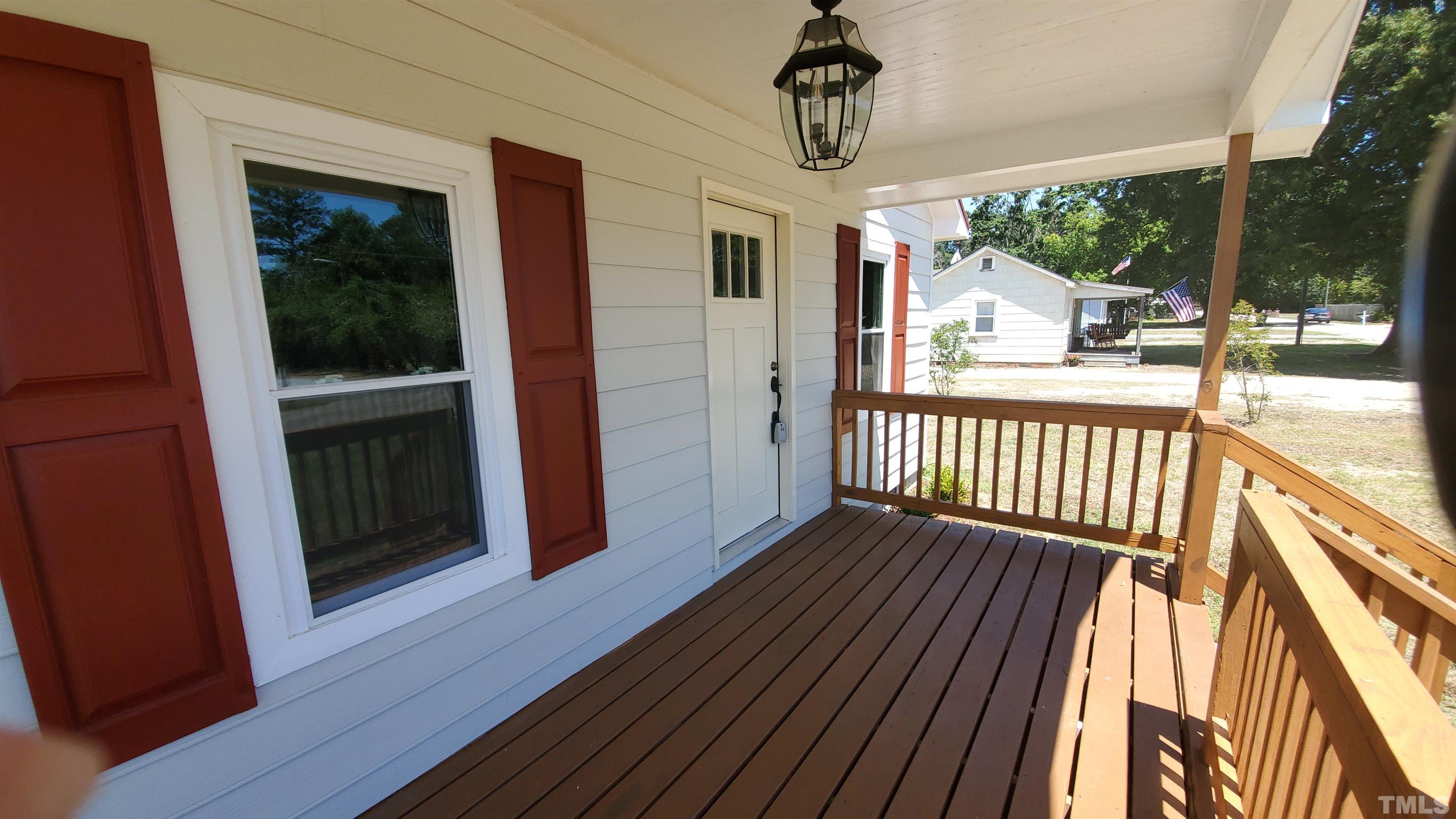 810 Raiford Road Erwin, NC 28339 - Photo 3 of 19 Large 16x6 front porch to enjoy morning coffee or enjoy the evenings under the cover.