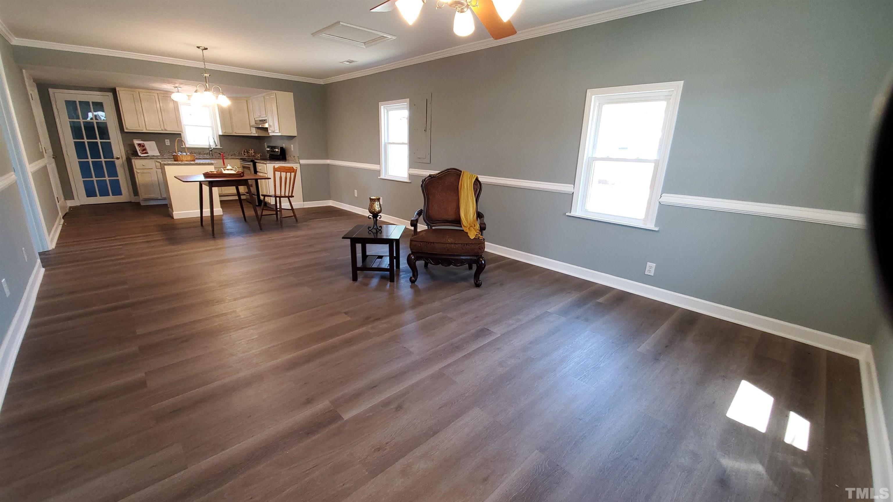 810 Raiford Road Erwin, NC 28339 - Photo 18 of 19 A large open floorplan from the front door to the back utility entrance.