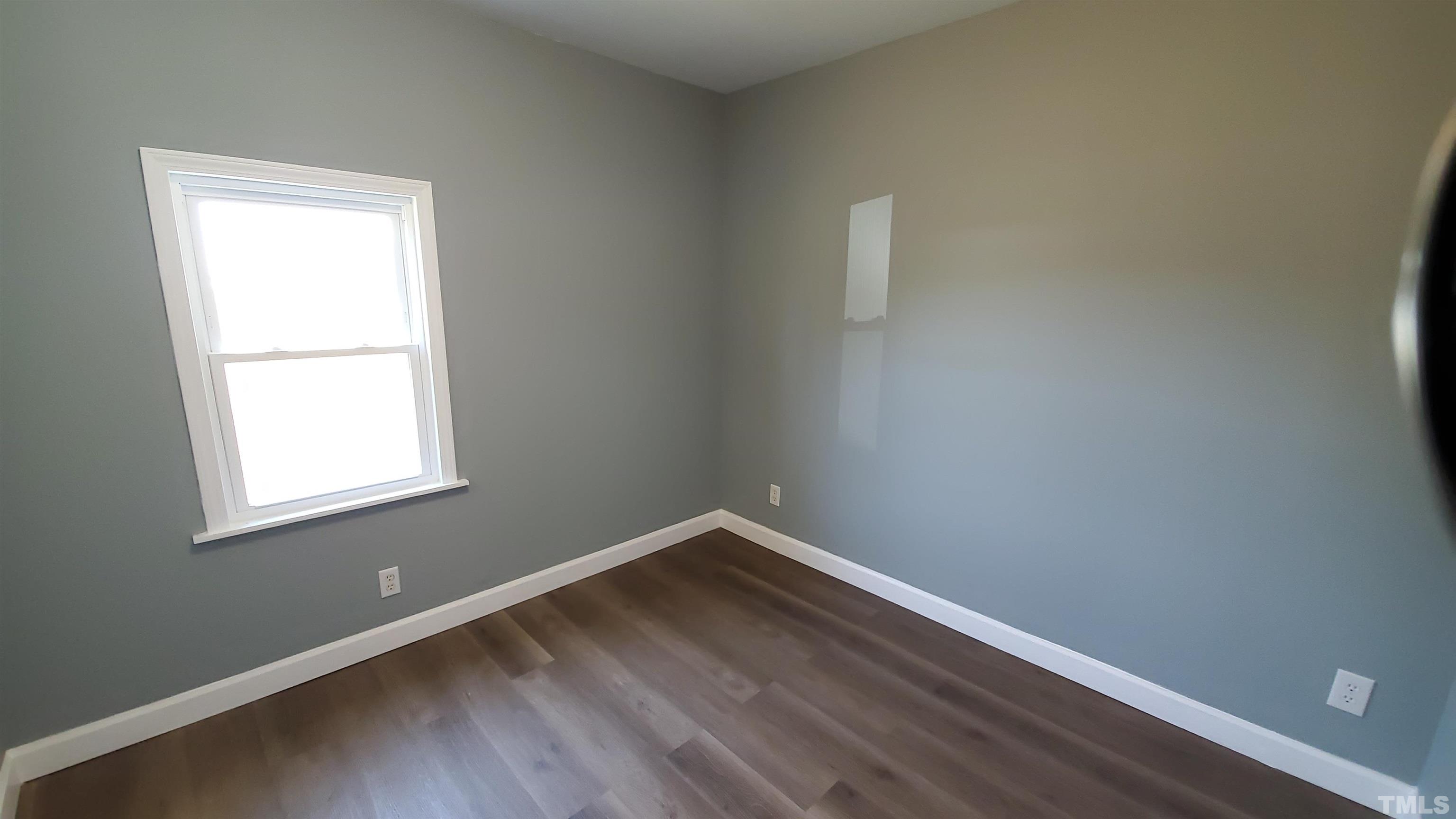 810 Raiford Road Erwin, NC 28339 - Photo 8 of 19 The second bedroom includes one window and a closet with mirrored doors as well.