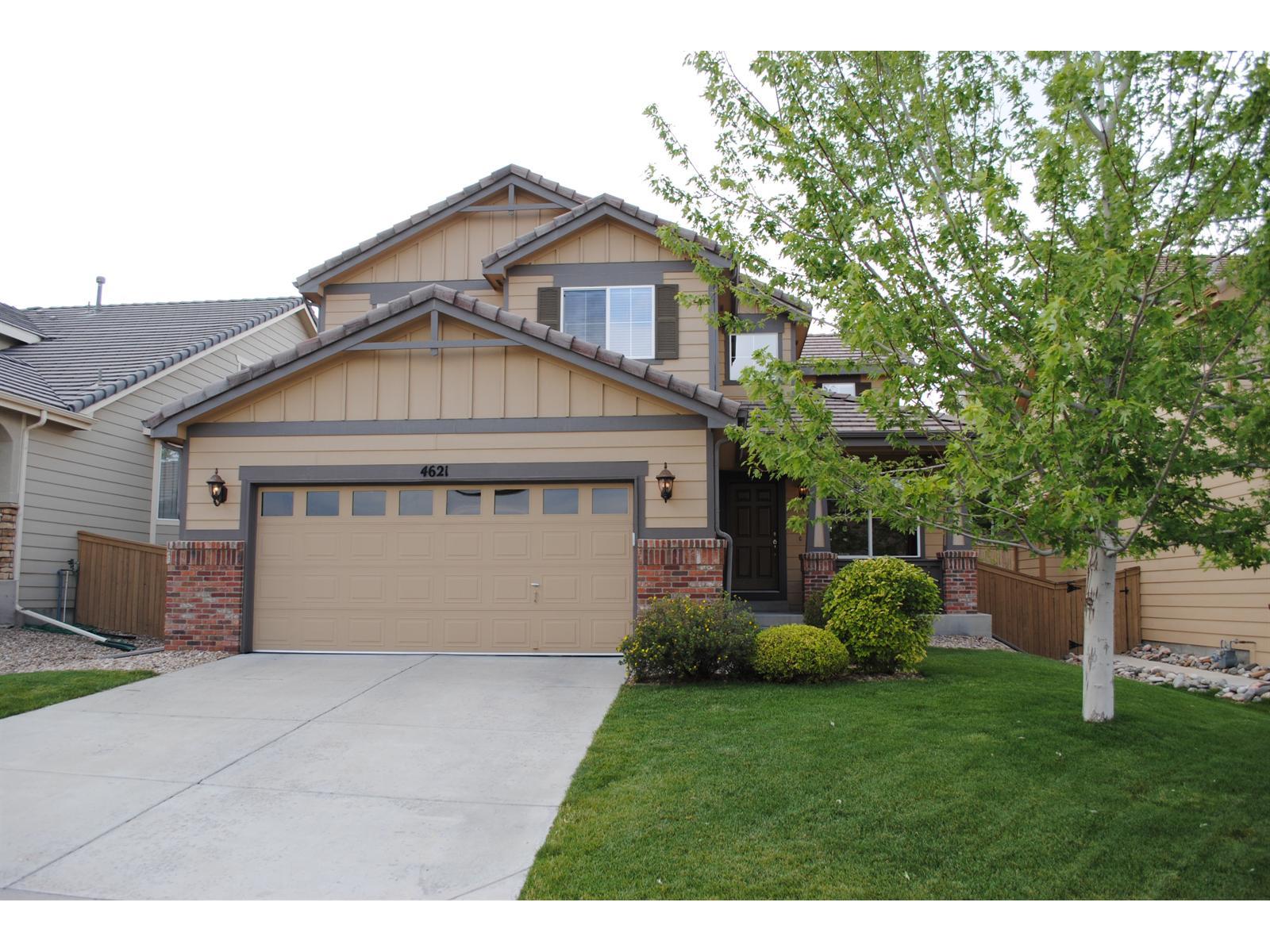 4621 Laurelglen Lane Highlands Ranch, CO 80130 - Photo 1 of 1 a front view of a house with a garden and plants