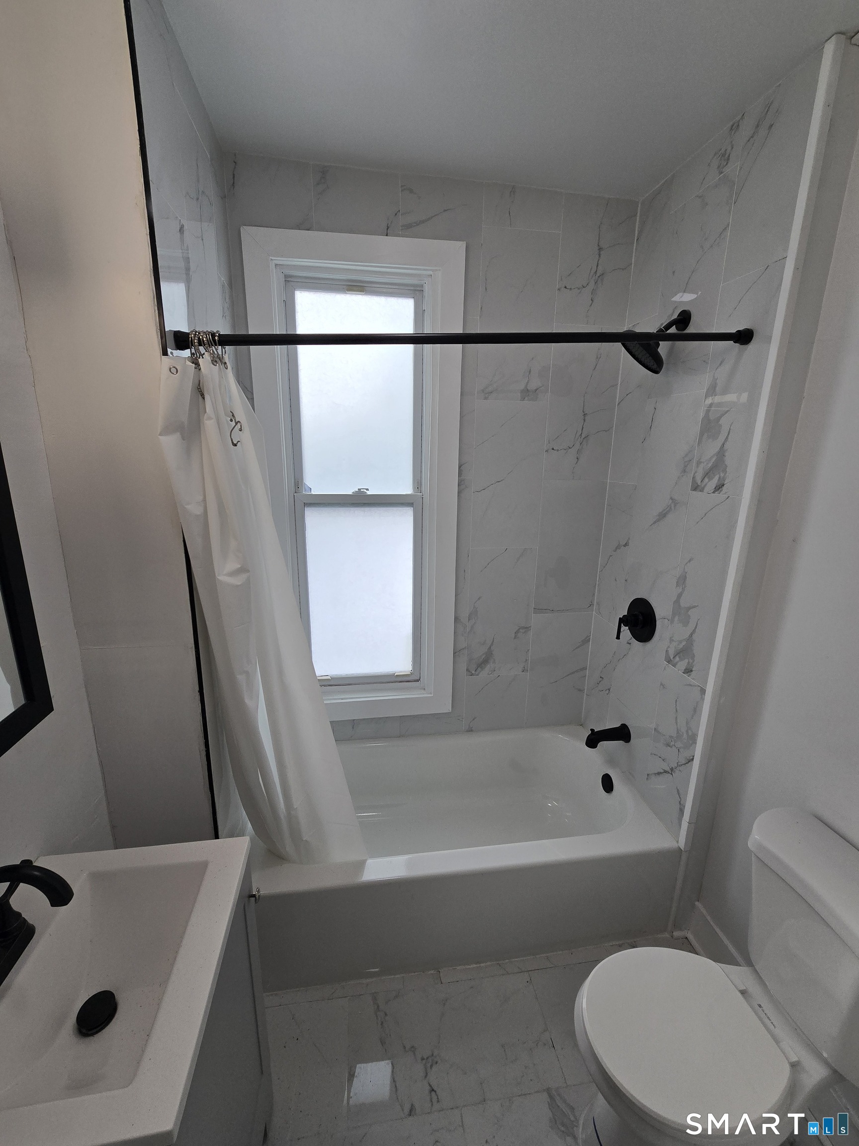 80 Dickerman Street New Haven, CT 06511 - Photo 13 of 31 a bathroom with a bathtub a window and a shower