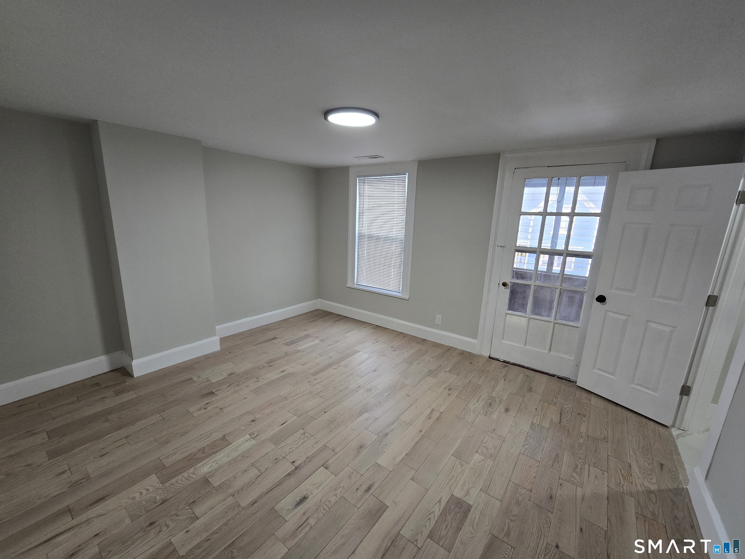 80 Dickerman Street New Haven, CT 06511 - Photo 18 of 31 a view of empty room with wooden floor and fan