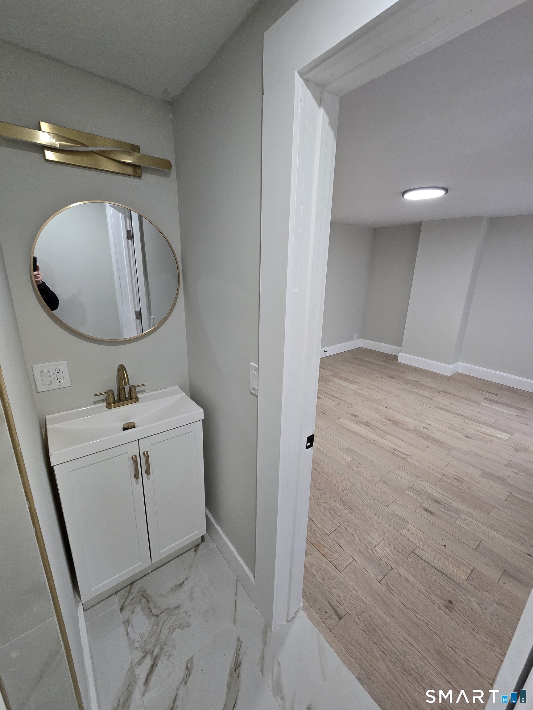 80 Dickerman Street New Haven, CT 06511 - Photo 20 of 31 a bathroom with a sink mirror and vanity