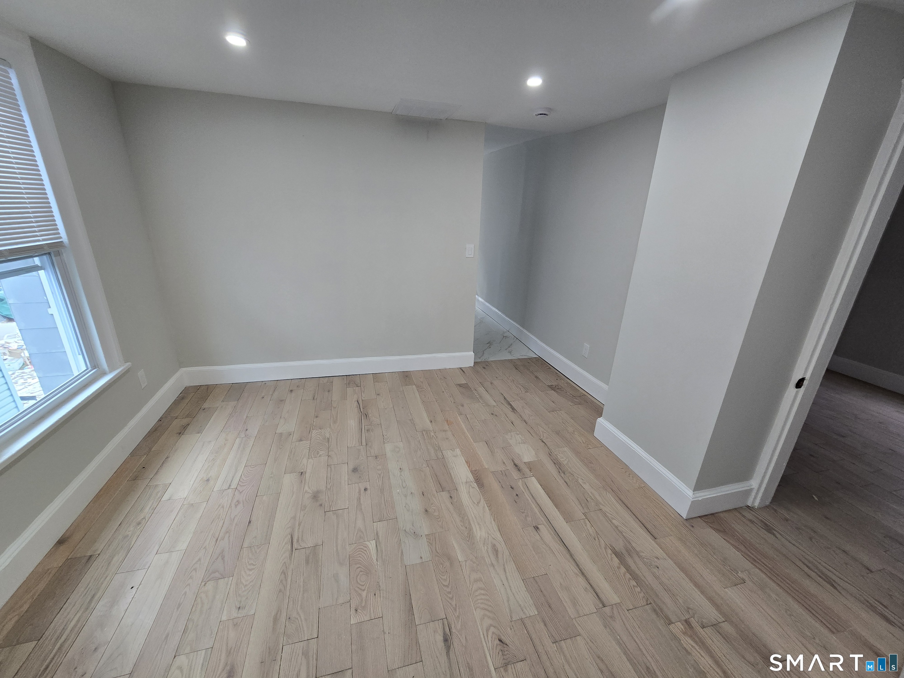 80 Dickerman Street New Haven, CT 06511 - Photo 24 of 31 wooden floor in an empty room with a window