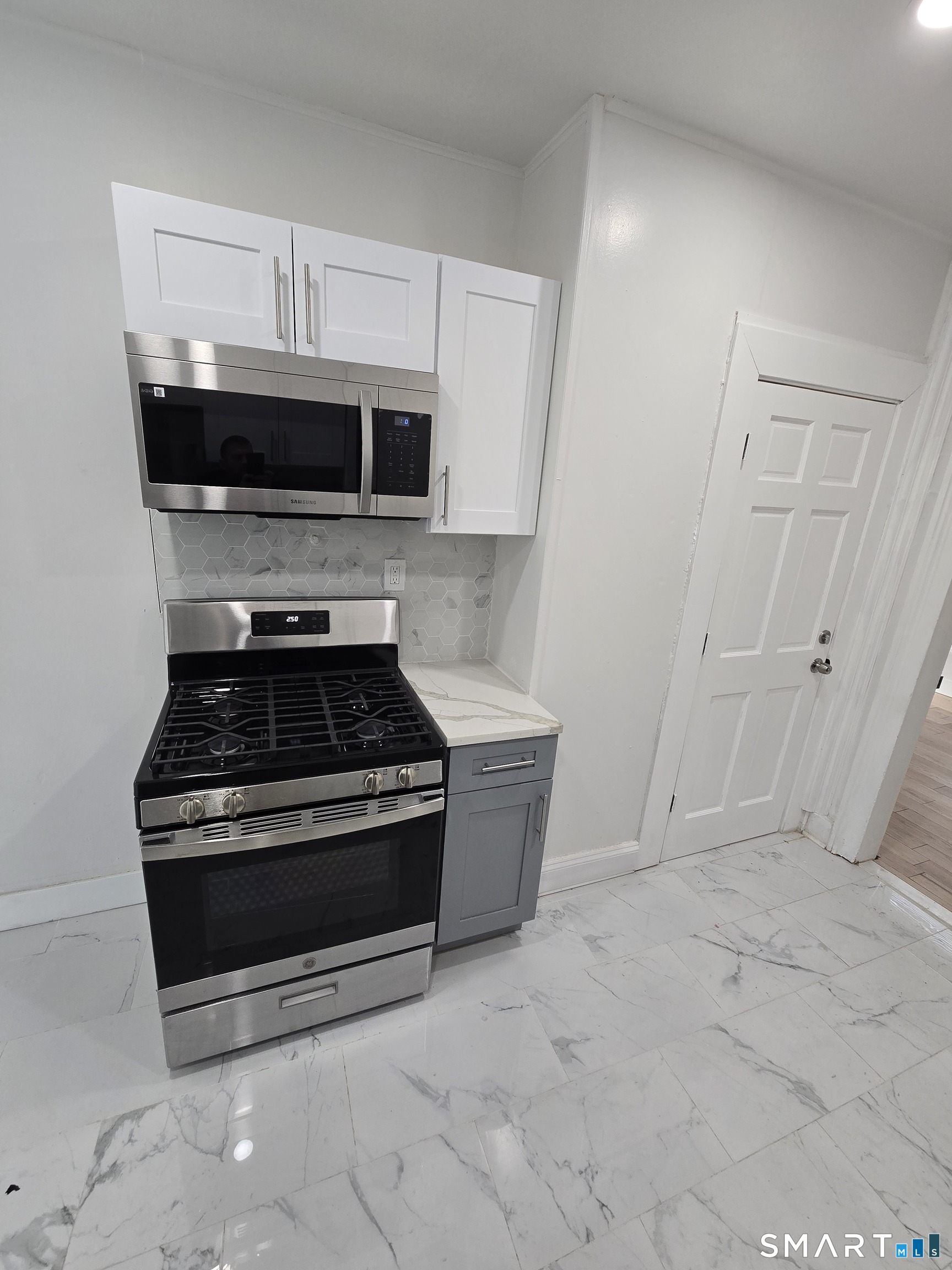 80 Dickerman Street New Haven, CT 06511 - Photo 3 of 31 a stove top oven sitting inside of a kitchen
