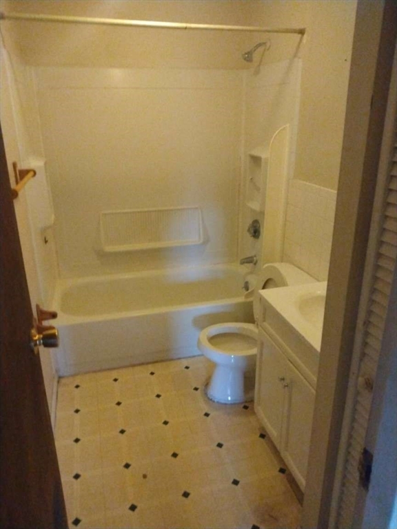 367 Hildreth Street, Unit 33 Lowell, MA 01850 - Photo 3 of 6 a bathroom with a sink a toilet and shower
