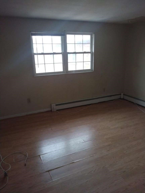 367 Hildreth Street, Unit 33 Lowell, MA 01850 - Photo 4 of 6 an empty room with a window