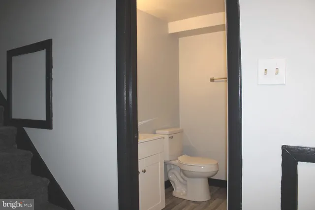a bathroom with a toilet and a shower