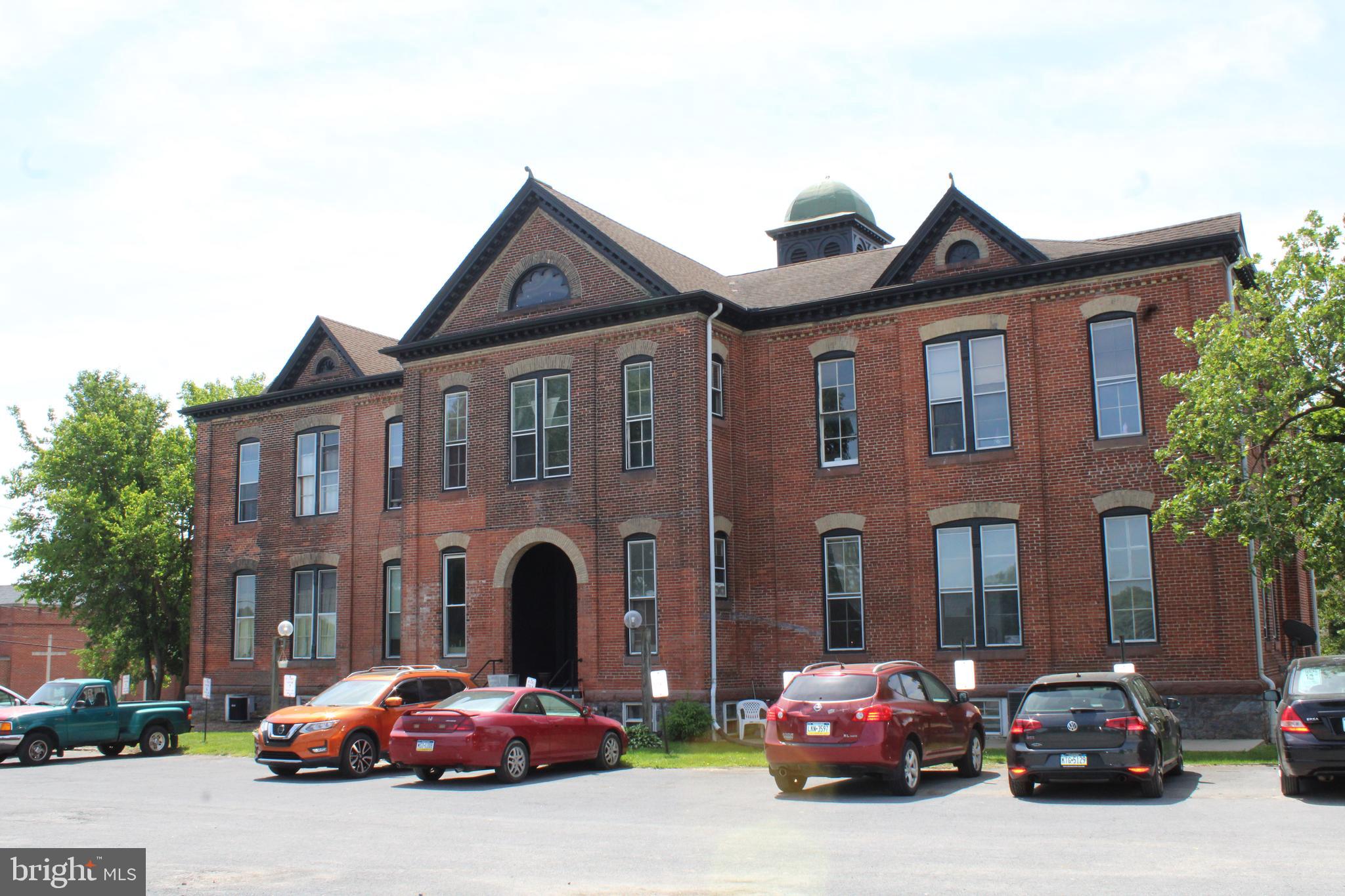 745 Manor Street, Unit 2 Columbia, PA 17512 - Photo 3 of 13 a front view of a house with cars parked