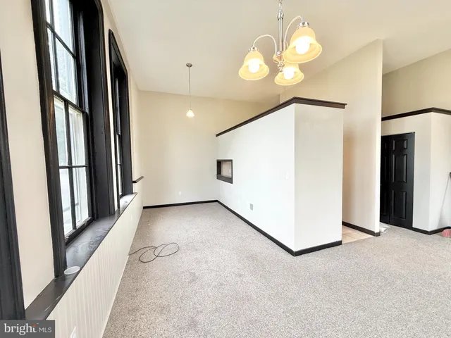 wooden floor in an empty room with a mirror