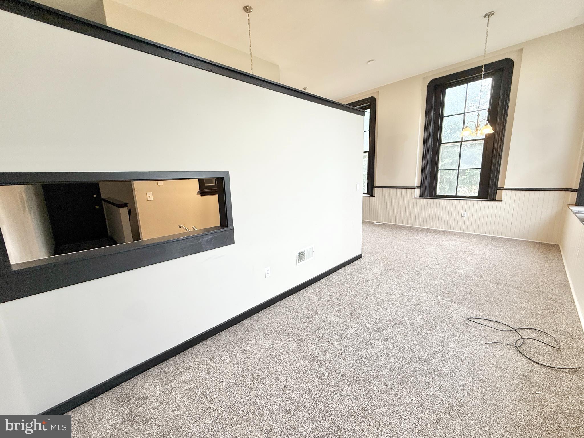 745 Manor Street, Unit 2 Columbia, PA 17512 - Photo 5 of 13 a view of an empty room with windows